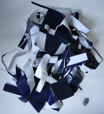 Offcuts from the billboard after the bags and before the purses.